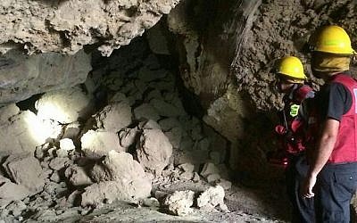 Firefighters look at the entrance to the Cave of Sodom that was blocked after a landslide on September 10, 2016. (Southern Region Fire Department Spokesperson)