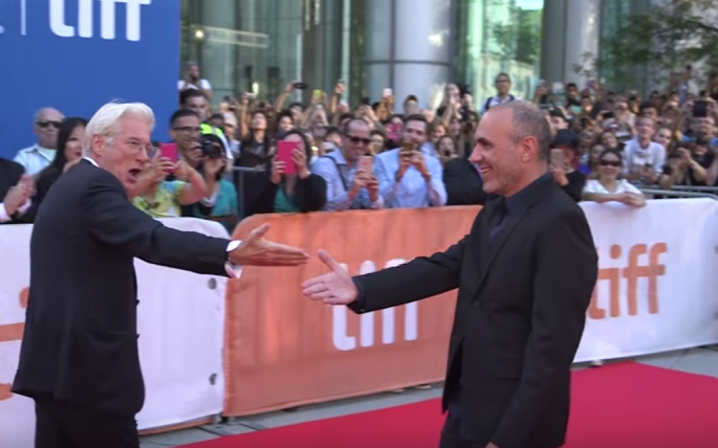 Actor Richard Gere introducing fans to filmmaker Joseph Cedar, who wrote and directed Gere's latest film, at the Toronto International Film Festival this past September. (Courtesy YouTube screen grab) Actor Richard Gere introducing fans to filmmaker Joseph Cedar, who wrote and directed Gere's latest film, at the Toronto International Film Festival this past September. (Courtesy YouTube screen grab)