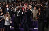 Republican presidential nominee Donald Trump isshown during a church service at Great Faith Ministries, Saturday, Sept. 3, 2016, in Detroit. (AP Photo/Evan Vucci)