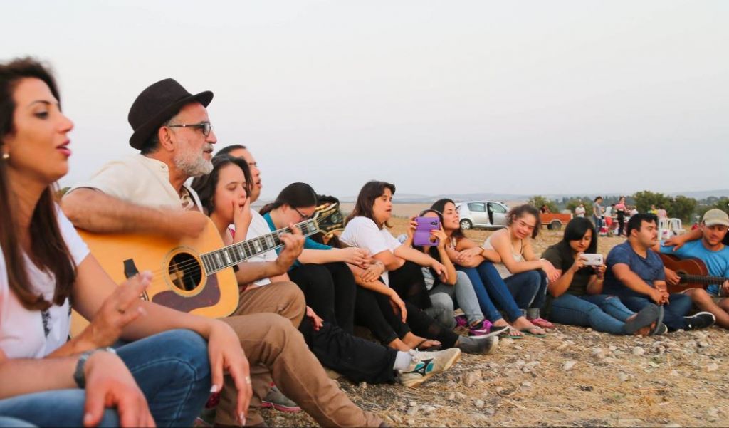 The group of trekkers from 'My Hero Brother' singing with Ehud Banai (Courtesy 'My Hero Brother')