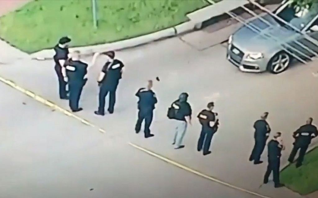 Police officers at the scene of a shooting in Houston, Texas, on Monday, September 26, 2016 (screen capture: YouTube)