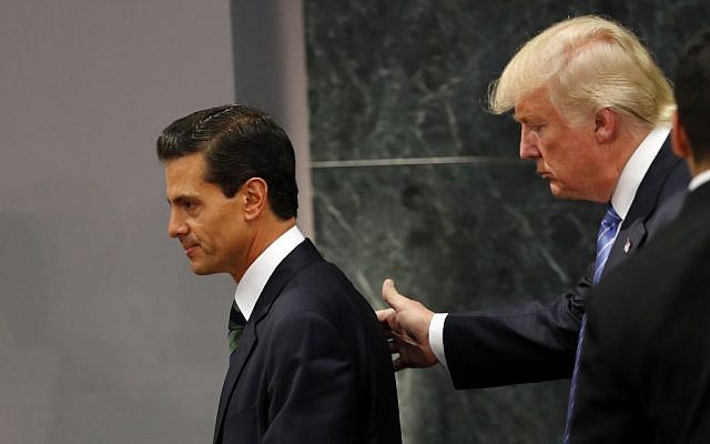 Republican presidential nominee Donald Trump walks with Mexican President Enrique Pena Nieto at the end of their joint statement at Los Pinos, the presidential official residence, in Mexico City, Wednesday, August 31, 2016. (AP Photo/Dario Lopez-Mills)