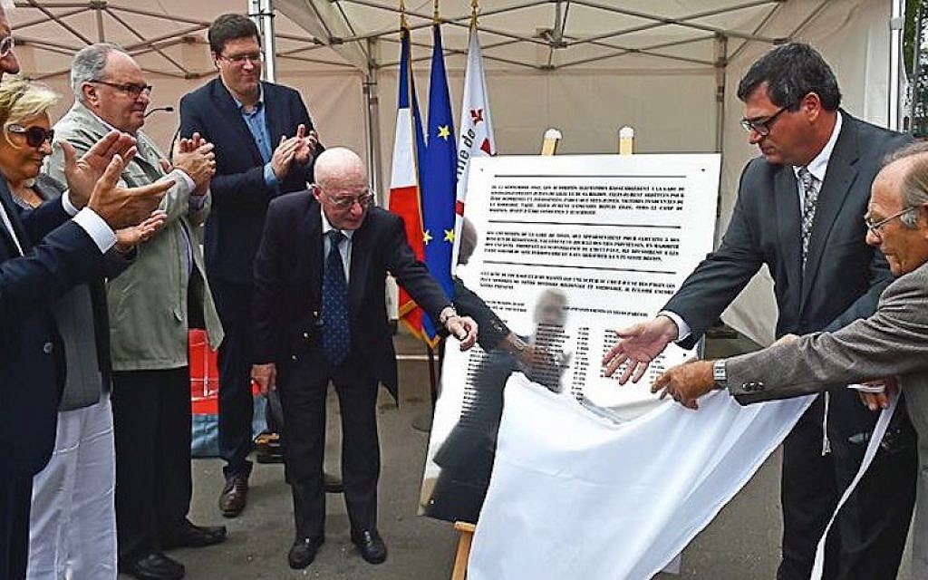 Jacques Stuzalft, left, helps unveil a plaque remembering the rescue of Jewish children of Lille, France, by local railway workers at a ceremony in the northern French city, Sept. 9, 2016. (City of Lille, via Facebook) Jacques Stuzalft, left, helps unveil a plaque remembering the rescue of Jewish children of Lille, France, by local railway workers at a ceremony in the northern French city, Sept. 9, 2016. (City of Lille, via Facebook)