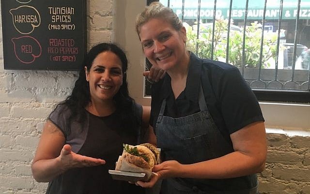 Israeli chef Einat Admony, left, with “Food Network” star Amanda Freitag at Taïm restaurant in New York’s Nolita neighborhood, Sept. 28, 2016 (JTA/Josefin Dolsten)