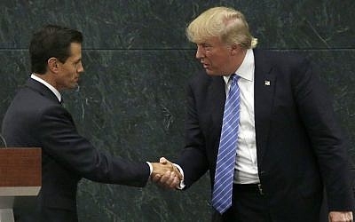 Mexican President Enrique Pena Nieto and then-Republican presidential nominee Donald Trump shake hands after a joint statement at Los Pinos, the presidential residence, Mexico City, Wednesday, August 31, 2016. (AP Photo/Marco Ugarte)