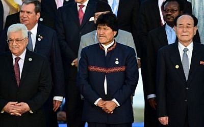 Bolivian President Evo Morales (C), North Korea's nominal head of state Kim Yong Nam (R) and Palestinian Authority President Mahmoud Abbas (L) pose during a group photo at the Non-Aligned Movement summit in Porlamar, Margarita Island, Venezuela, on September 17, 2016. (AFP PHOTO/RONALDO SCHEMIDT)