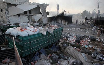 Aid is strewn across the floor in the town of Orum al-Kubra on the western outskirts of Aleppo on September 20, 2016, the morning after a convoy delivering it was hit by a deadly air strike. (AFP PHOTO/Omar Haj Kadour)