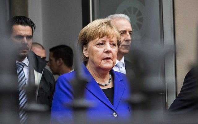 German Chancellor Angela Merkel and the prime minister for the federal state of Saxony, Stanislaw Tillich, right, take part in festivities to celebrate the Day of German Unity in Dresden on October 3, 2016. (AFP Photo/Odd Andersen) German Chancellor Angela Merkel and the prime minister for the federal state of Saxony, Stanislaw Tillich, right, take part in festivities to celebrate the Day of German Unity in Dresden on October 3, 2016. (AFP Photo/Odd Andersen)