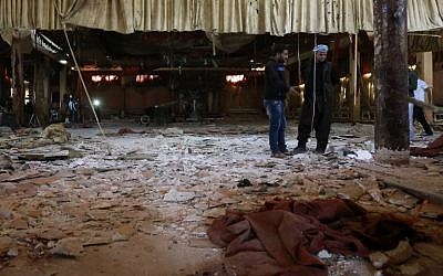 Syrian men inspect the damage at a wedding hall on October 4, 2016, a day after a suicide attack targeted a Kurdish wedding party in the village of Tall Tawil in the Hasakeh province, killing 33 people. (AFP PHOTO/DELIL SOULEIMAN)