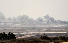A picture taken from the Israel-Gaza border shows smoke rising from the Hamas-ruled Gaza Strip following an Israeli military strike on October 5, 2016. (Jack Guez/AFP)