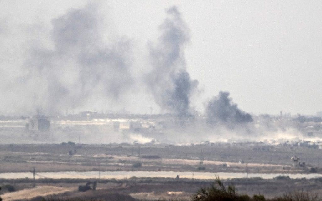 A picture taken from the Israel-Gaza border shows smoke rising from the Palestinian Hamas-run Gaza Strip following an Israeli military strike on October 5, 2016. (AFP/JACK GUEZ)