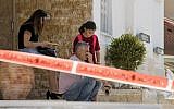 Israelis sit outside their home near the site where a rocket fired from the Gaza Strip hit in the southern Israeli town of Sderot, on October 5, 2016. (Jack Guez/AFP)
