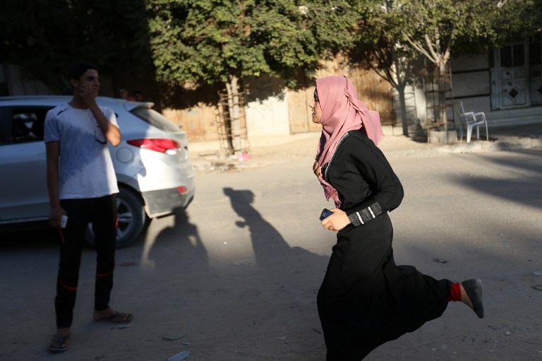 A Palestinian girl runs out of her home in Gaza City's eastern Shejaiya neighborhood following an Israeli military strike on October 5, 2016. (Mohammed Abed/AFP) A Palestinian girl runs out of her home in Gaza City's eastern Shejaiya neighborhood following an Israeli military strike on October 5, 2016. (Mohammed Abed/AFP)