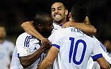 Israel's players celebrate after Tomer Hemed (No. 10) scores during the World Cup 2018 qualification match between Macedonia and Israel in Skopje on October 6, 2016. Israel won 2-1 (AFP/Robert Atanasovski)