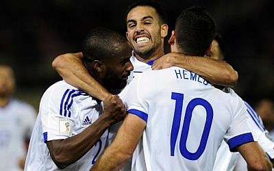 Israel's players celebrate after Tomer Hemed (No. 10) scores during the World Cup 2018 qualification match between Macedonia and Israel in Skopje on October 6, 2016. Israel won 2-1 (AFP/Robert Atanasovski)