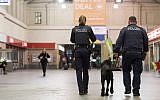 Illustrative: Police officers patrol at a train station in Chemnitz, eastern Germany, on October 8, 2016. (AFP Photo/Jens-Ulrich Koch)