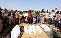 Yemenis attend the funeral of members of the same family on October 8, 2016 a day after they were killed in a reported airstrike by Saudi-led coalition air-planes that hit their house in Bajil in the western province of Houdieda. (AFP PHOTO / STRINGER)