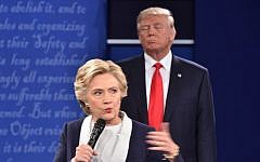Republican presidential candidate Donald Trump listens to Democratic presidential candidate Hillary Clinton during the second presidential debate at Washington University in St. Louis, Missouri on October 9, 2016 (AFP/ Paul J. Richards)