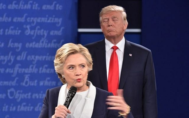 Republican presidential candidate Donald Trump listens to Democratic presidential candidate Hillary Clinton during the second presidential debate at Washington University in St. Louis, Missouri on October 9, 2016 (AFP/ Paul J. Richards) Republican presidential candidate Donald Trump listens to Democratic presidential candidate Hillary Clinton during the second presidential debate at Washington University in St. Louis, Missouri on October 9, 2016 (AFP/ Paul J. Richards)