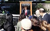 People look at the 'All-Seeing Trump', a fortune-telling fairground attraction resembling Republican presidential nominee Donald Trump, in New York on October 12, 2016. (AFP/William Edwards)