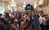 The audience reacts as Permanent Secretary of the Swedish Academy Sara Danius announces that Bob Dylan is awarded the 2016 Nobel Prize in Literature during a presser at the Old Stockholm Stock Exchange Building in Stockholm, October 13, 2016. (AFP/TT News Agency/Jonas Ekstromer)