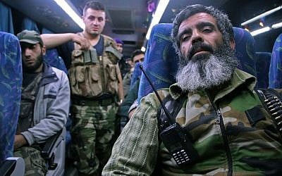 Syrian rebel fighters and their families arrive on the outskirts of Idlib, bordering the Hama province, following their evacuation from Qudssaya and al-Hamah, rebel-held neighbourhoods of the Syrian capital, on October 14, 2016. (AFP PHOTO / OMAR HAJ KADOUR)