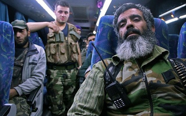 Syrian rebel fighters and their families arrive on the outskirts of Idlib, bordering the Hama province, following their evacuation from Qudssaya and al-Hamah, rebel-held neighbourhoods of the Syrian capital, on October 14, 2016. (AFP PHOTO / OMAR HAJ KADOUR) Syrian rebel fighters and their families arrive on the outskirts of Idlib, bordering the Hama province, following their evacuation from Qudssaya and al-Hamah, rebel-held neighbourhoods of the Syrian capital, on October 14, 2016. (AFP PHOTO / OMAR HAJ KADOUR)