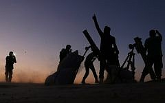 Fighters from the Free Syrian Army cheer and react as they fight against the Islamic State (IS) group jihadists on the outskirts of the northern Syrian town of Dabiq, on October 15, 2016.(AFP PHOTO / Nazeer al-Khatib)