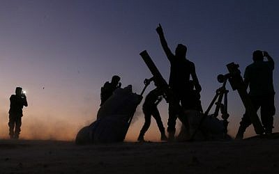 Fighters from the Free Syrian Army cheer and react as they fight against the Islamic State (IS) group jihadists on the outskirts of the northern Syrian town of Dabiq, on October 15, 2016.(AFP PHOTO / Nazeer al-Khatib) Fighters from the Free Syrian Army cheer and react as they fight against the Islamic State (IS) group jihadists on the outskirts of the northern Syrian town of Dabiq, on October 15, 2016.(AFP PHOTO / Nazeer al-Khatib)