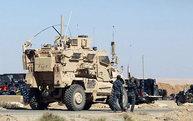 A US-made armored combat vehicle is seen parked at the Qayyarah military base, about 60 kilometers (35 miles) south of Mosul, on October 16, 2016, ahead of an offensive to retake the last IS-held city in Iraq. (AFP PHOTO/AHMAD AL-RUBAYE) A US-made armored combat vehicle is seen parked at the Qayyarah military base, about 60 kilometers (35 miles) south of Mosul, on October 16, 2016, ahead of an offensive to retake the last IS-held city in Iraq. (AFP PHOTO/AHMAD AL-RUBAYE)