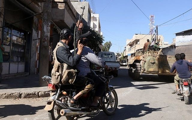 Rebel fighters celebrate their capturing of the town of Dabiq in the streets of the northern Syrian town of Marea, on October 16, 2016. (AFP PHOTO / Nazeer al-Khatib) Rebel fighters celebrate their capturing of the town of Dabiq in the streets of the northern Syrian town of Marea, on October 16, 2016. (AFP PHOTO / Nazeer al-Khatib)