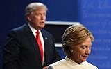 Democratic nominee Hillary Clinton, right, and Republican nominee Donald Trump walk off the stage after the final presidential debate at the Thomas & Mack Center on the campus of the University of Nevada, Las Vegas in Las Vegas, Nevada on October 19, 2016. (Robyn Beck/AFP)