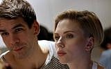 US actress Scarlett Johansson and her husband Romain Dauriac listen to a customer at the opening of the Yummy Pop gourmet popcorn shop in the Marais district of Paris on October 22, 2016. (Benjamin Cremel/AFP)