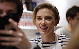 US actress Scarlett Johansson smiles at the opening of the Yummy Pop gourmet popcorn shop in the Marais district of Paris on October 22, 2016. (Benjamin Cremel/AFP)
