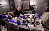 Shaul Yakobi, inventor and co-founder at Aquarius Engines, poses for a photo with the single-piston car engine he invented, at Campus Automobile Spa-Francorchamps in Belgium on October 19, 2016. (AFP/Emmanuel Dunand)