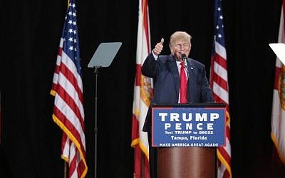 Republican presidential nominee Donald Trump gives a thumbs-up to supporters during a campaign stop in Tampa, Florida, on October 24, 2016. (AFP/Gregg Newton)