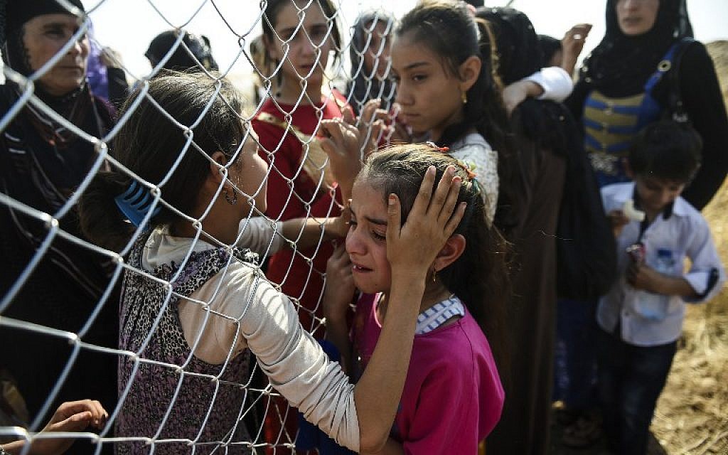 Newly displaced Iraqi's who fled from the city of Mosul,  are reunited with their relatives who came two years ago to a refugee camp some 40 kilometres east of Arbil on October 26, 2016. ( AFP PHOTO / BULENT KILIC)