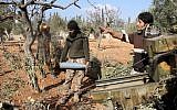 Rebel fighters from the Jaish al-Fatah Brigades prepare mortar shells before firing towards western government-controlled districts of Aleppo on October 30, 2016, the third day of a rebel offensive to break a three-month siege of the opposition-held east of Syria's second city. (AFP Photo/Omar Haj Kadour)