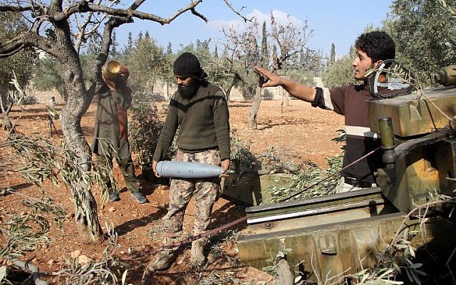 Rebel fighters from the Jaish al-Fatah Brigades prepare mortar shells before firing towards western government-controlled districts of Aleppo on October 30, 2016, the third day of a rebel offensive to break a three-month siege of the opposition-held east of Syria's second city. (AFP Photo/Omar Haj Kadour) Rebel fighters from the Jaish al-Fatah Brigades prepare mortar shells before firing towards western government-controlled districts of Aleppo on October 30, 2016, the third day of a rebel offensive to break a three-month siege of the opposition-held east of Syria's second city. (AFP Photo/Omar Haj Kadour)