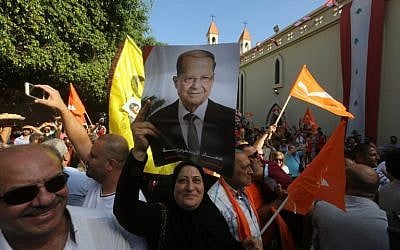 Supporters of Lebanon's Free Patriotic Movement celebrate the election of their leader Michel Aoun in the town of Jdeideh, north of Beirut, on October 31, 2016. (AFP PHOTO/MARWAN TAHTAH)
