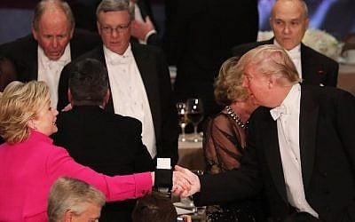Hillary Clinton shakes hands with Donald Trump while attending the annual Alfred E. Smith Memorial Foundation Dinner at the Waldorf Astoria on October 20, 2016 in New York City. (Spencer Platt/Getty Images/AFP)