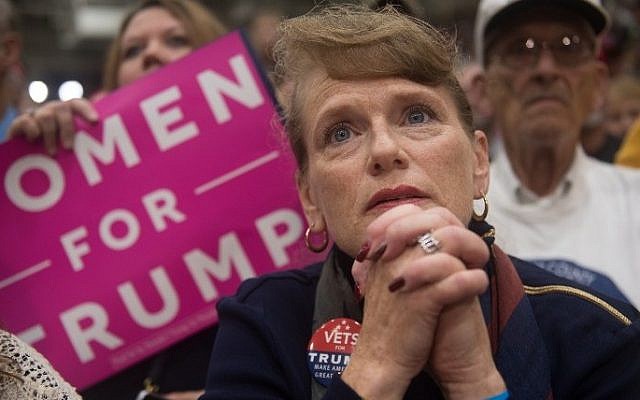 A supporter of Republican presidential candidate Donald Trump listens on as he speaks during a campaign stop at the Cambria County War Memorial Arena on October 21, 2016 in Johnstown, Pennsylvania. (Justin Merriman/Getty Images/AFP)