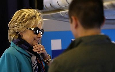 Democratic presidential nominee and former secretary of state Hillary Clinton talks with members of her staff aboard her campaign plane at Westchester County Airport in White Plains, New York on October 29, 2016.  (Justin Sullivan/Getty Images/AFP)