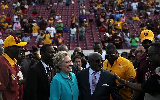 Democratic presidential nominee Hillary Clinton greets attendees during a tailgate homecoming party at Bethune-Cookman University on October 29, 2016 in Daytona Beach, Florida. (Justin Sullivan/Getty Images/AFP) Democratic presidential nominee Hillary Clinton greets attendees during a tailgate homecoming party at Bethune-Cookman University on October 29, 2016 in Daytona Beach, Florida. (Justin Sullivan/Getty Images/AFP)