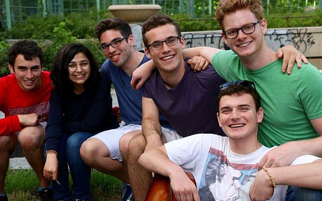 Hillel Zand (bottom right) with fellow American student volunteers with IsraAID and a Syrian refugee (second from left). Berlin, summer 2016. (Hillel Zand) Hillel Zand (bottom right) with fellow American student IsraAID volunteers and a Syrian refugee (second from left). Berlin, summer 2016. (Hillel Zand)