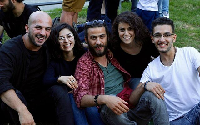 An IsraAID staff member (second from right) with Middle Eastern refugees in Berlin, summer 2016. (Hillel Zand) An IsraAID staff member (second from right) with Middle Eastern refugees in Berlin, summer 2016. (Hillel Zand)