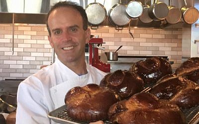 Executive pastry chef Alex Levin with challah breads he prepared for Rosh Hashana pop-up bakery at Osteria Morini in Washington, DC, October 2016. (Courtesy)