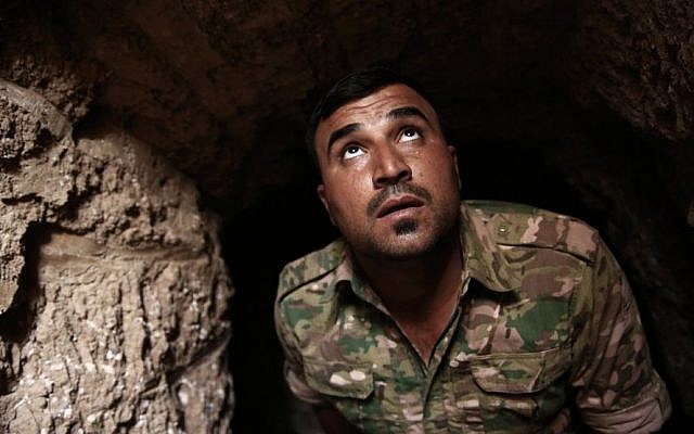 A peshmerga fighter looks out of the entrance of an underground tunnel built by Islamic State fighters, Tuesday, Oct. 18, 2016. (AP/Bram Janssen) A peshmerga fighter looks out of the entrance of an underground tunnel built by Islamic State fighters, Tuesday, Oct. 18, 2016. (AP/Bram Janssen)
