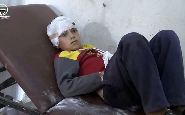 Frame grab from video provided by Muaz al-Shami, Syrian Revolution Network, an opposition activist media organization, shows a child on a hospital bed, with a bandage around his head after airstrikes killed over 20 people, in the northern rebel-held village of Hass, Syria, Wednesday, October 26, 2016. (Muaz al-Shami, Syrian Revolution Network, via AP) Frame grab from video provided by Muaz al-Shami, Syrian Revolution Network, an opposition activist media organization, shows a child on a hospital bed, with a bandage around his head after airstrikes killed over 20 people, in the northern rebel-held village of Hass, Syria, Wednesday, October 26, 2016. (Muaz al-Shami, Syrian Revolution Network, via AP)