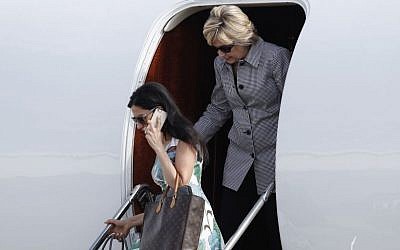 Democratic presidential nominee Hillary Clinton and aide Huma Abedin, lower left, step from Clinton's campaign plane as they arrive at Van Nuys Airport in Van Nuys, Calif., Monday, Aug. 22, 2016. (Carolyn Kaster/AP) 